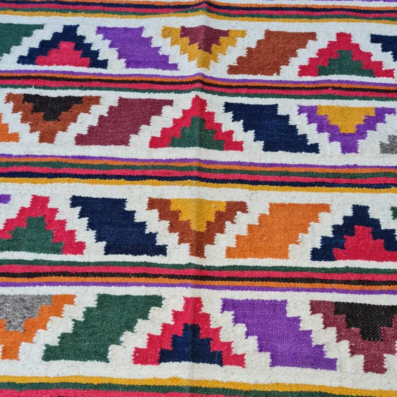 Handwoven Guatemalan wool rug poncho made in Momostenango