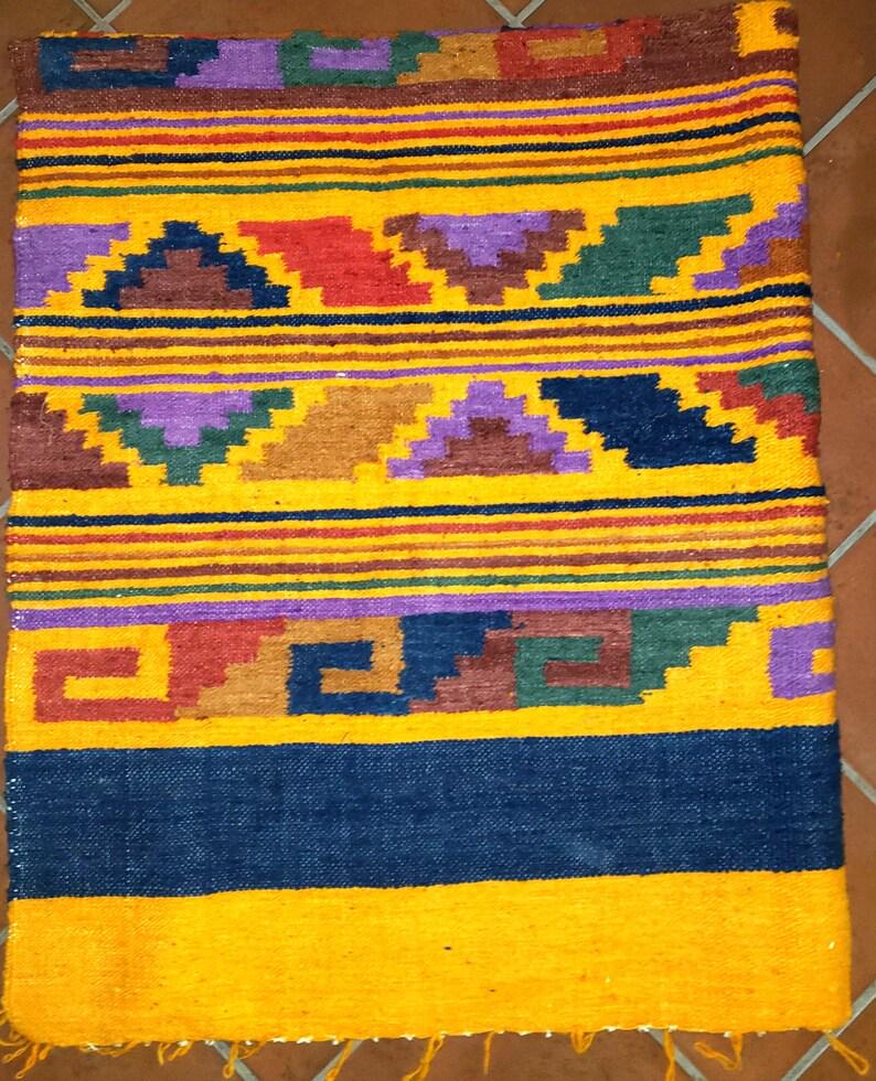 Handwoven Guatemalan wool rug poncho made in Momostenango