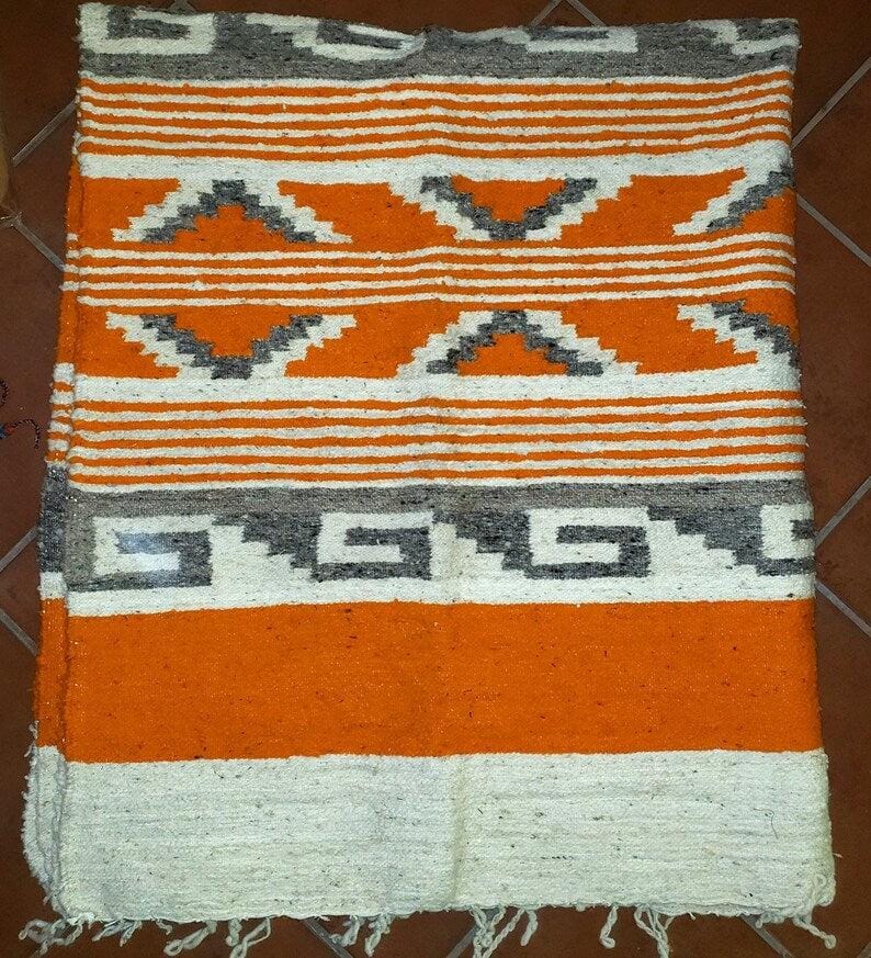 Handwoven Guatemalan wool rug poncho made in Momostenango